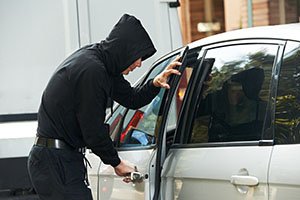 guy breaking into a car